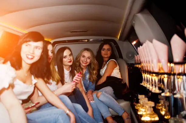 Luxury limousine service by transportmovehub.xyz showcasing satisfied customers enjoying memorable experiences.